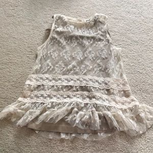 A tan tank top to go under the lace shirt.